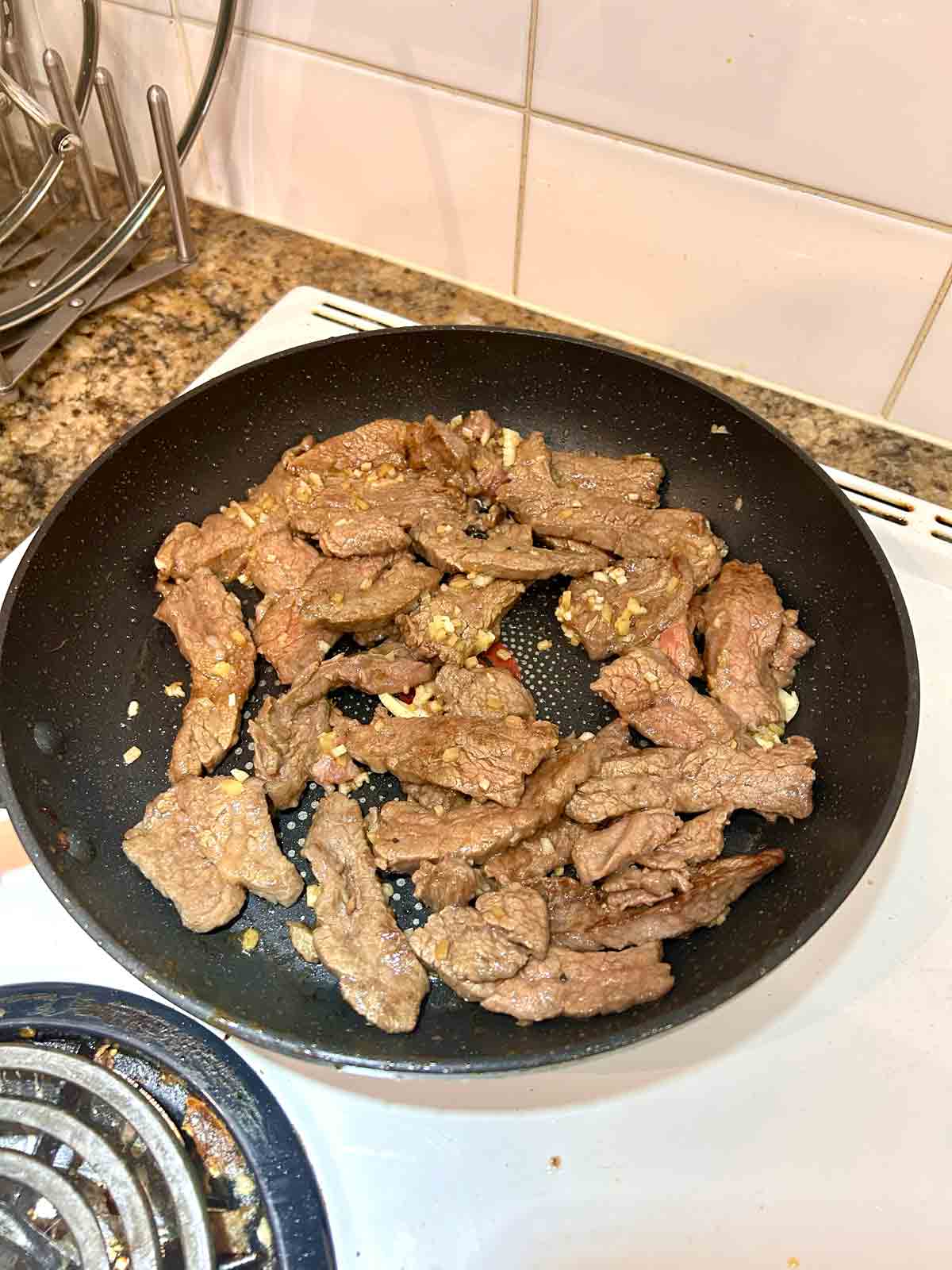 garlic and ginger stirred into beef.