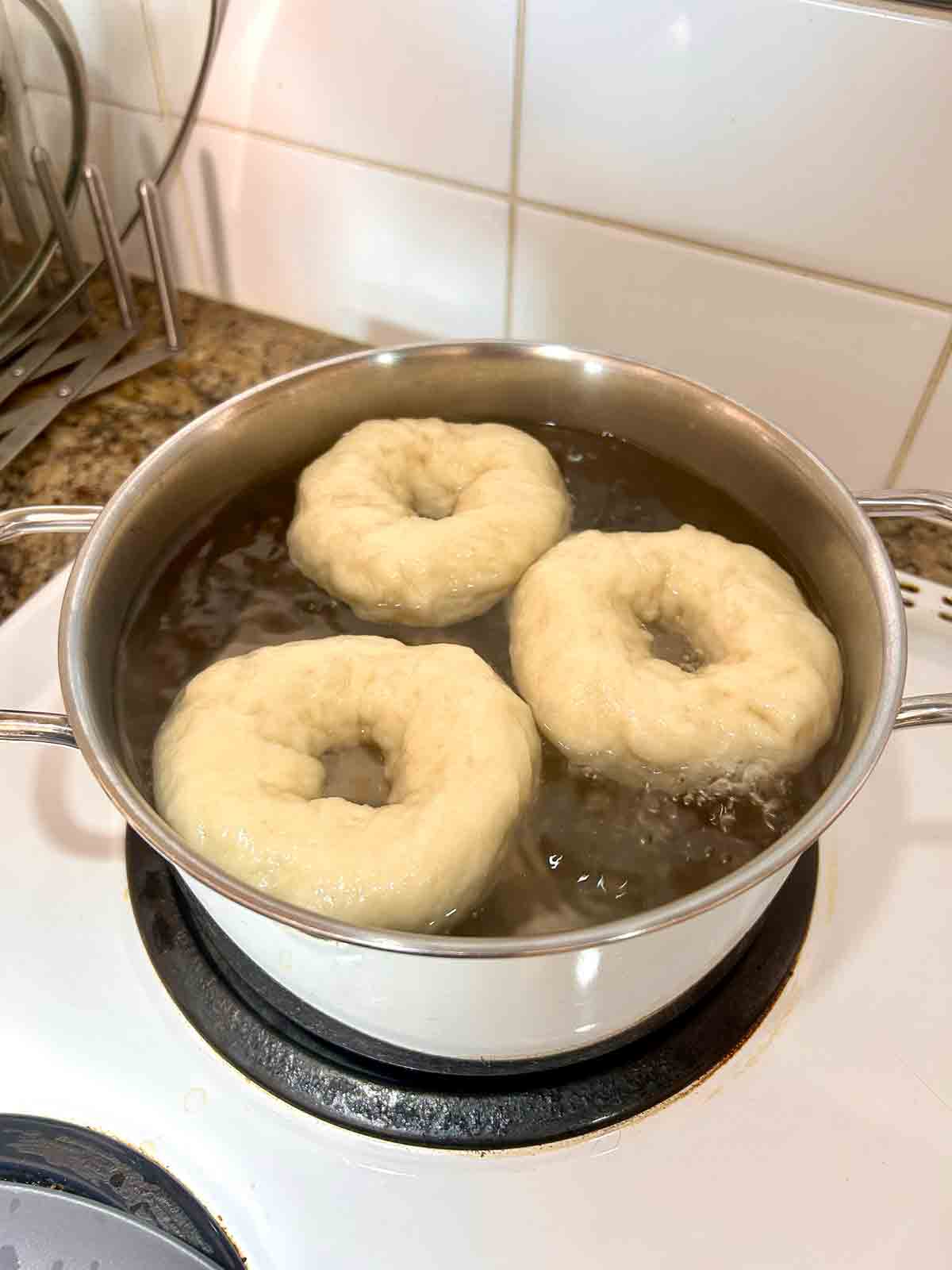 bagels boiling in honey water.