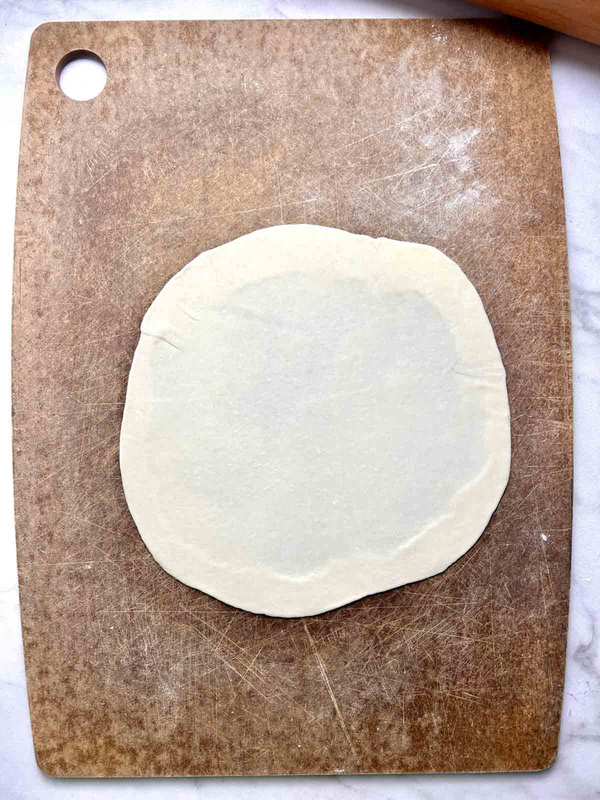 dough rolled thinly on floured cutting board.