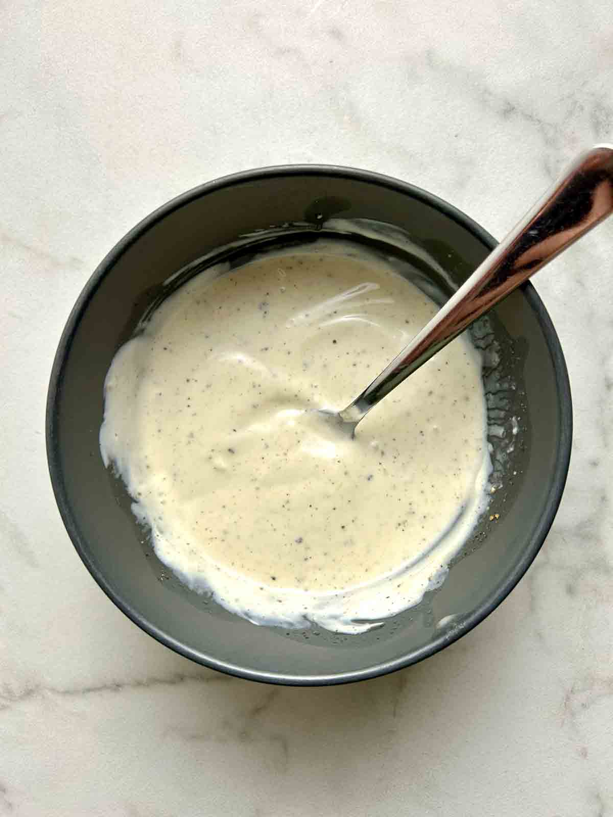 salad dressing mixed in bowl.
