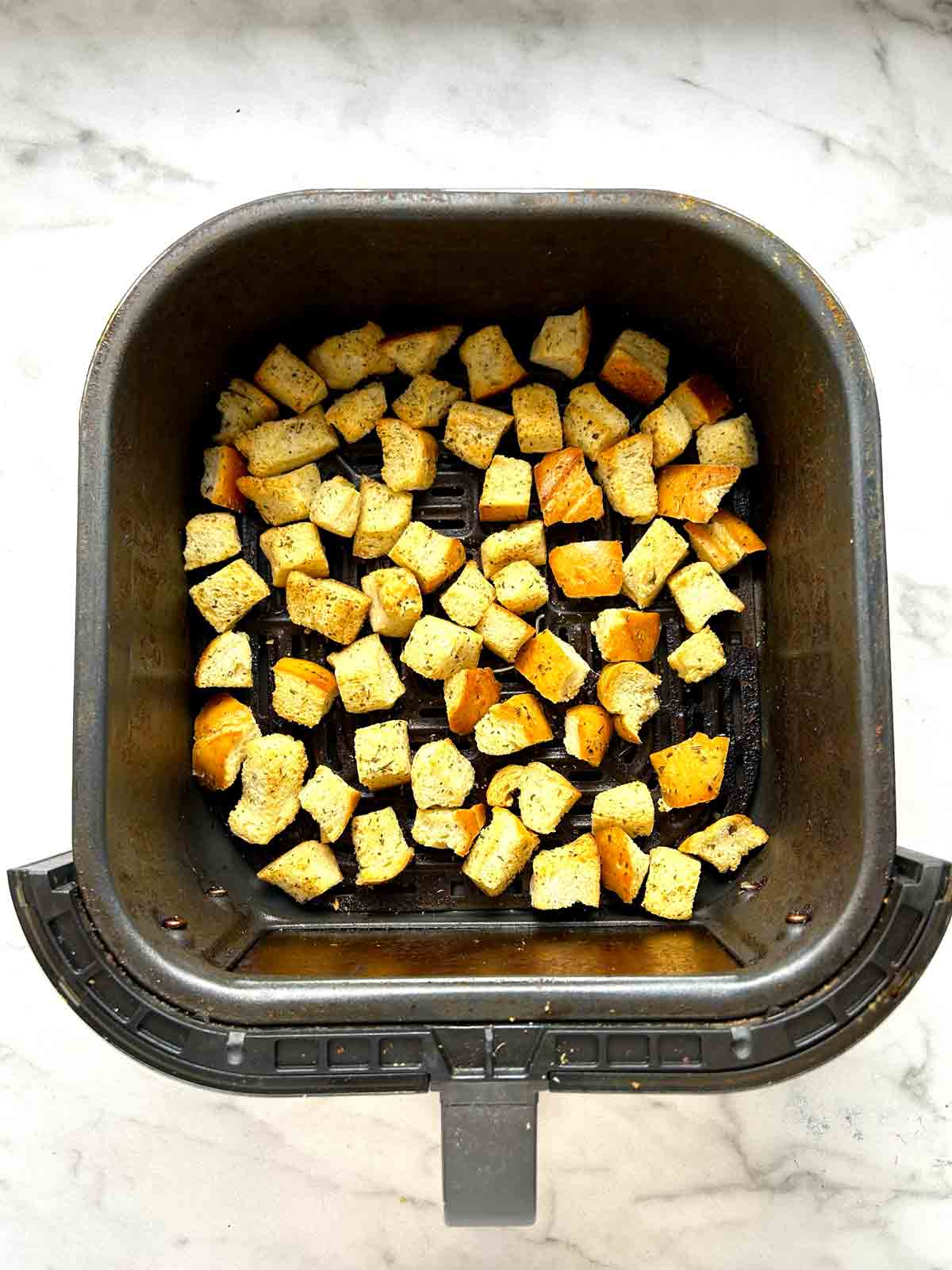 bread cubes after air frying.