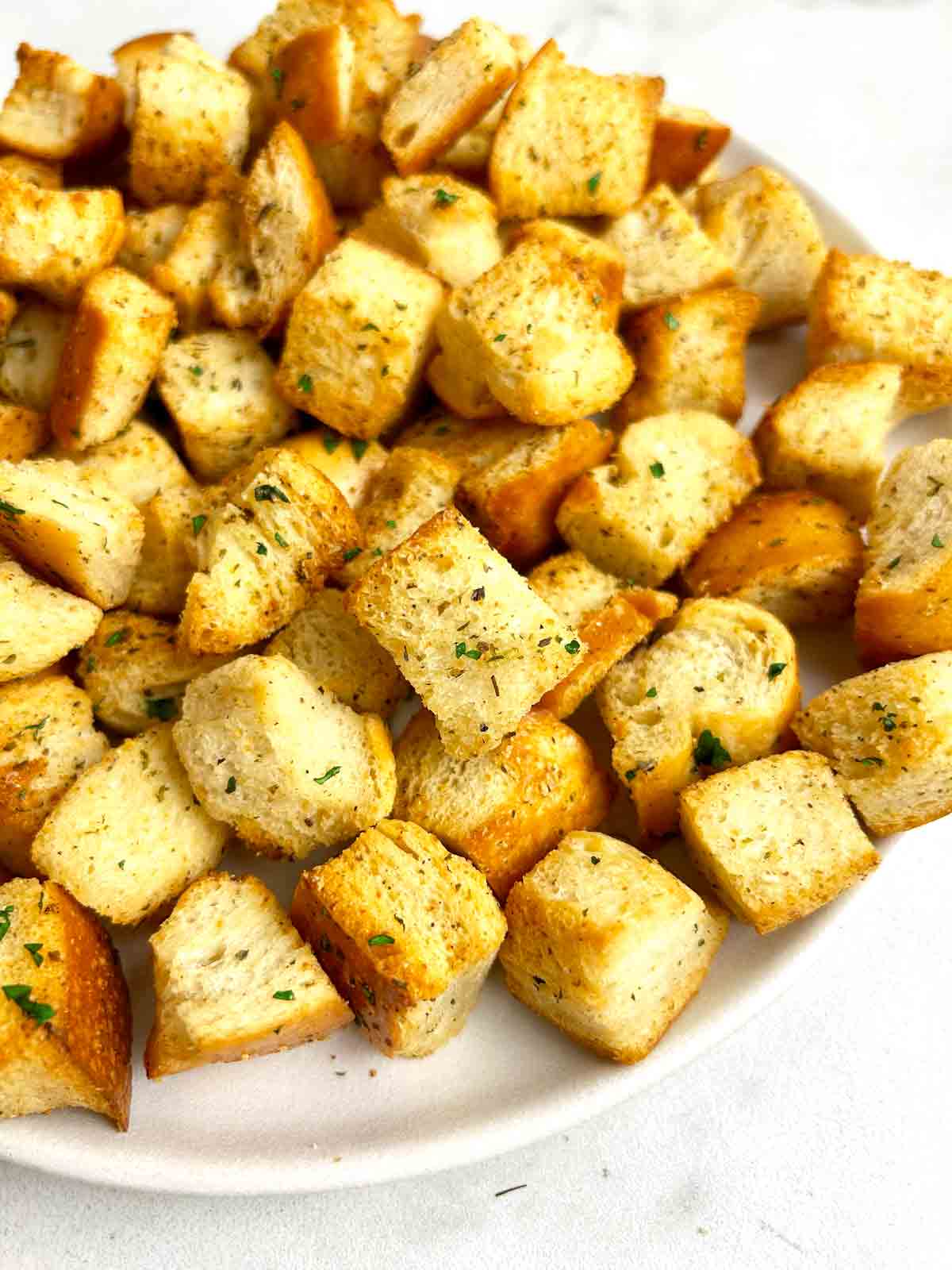 close up of air fryer croutons.