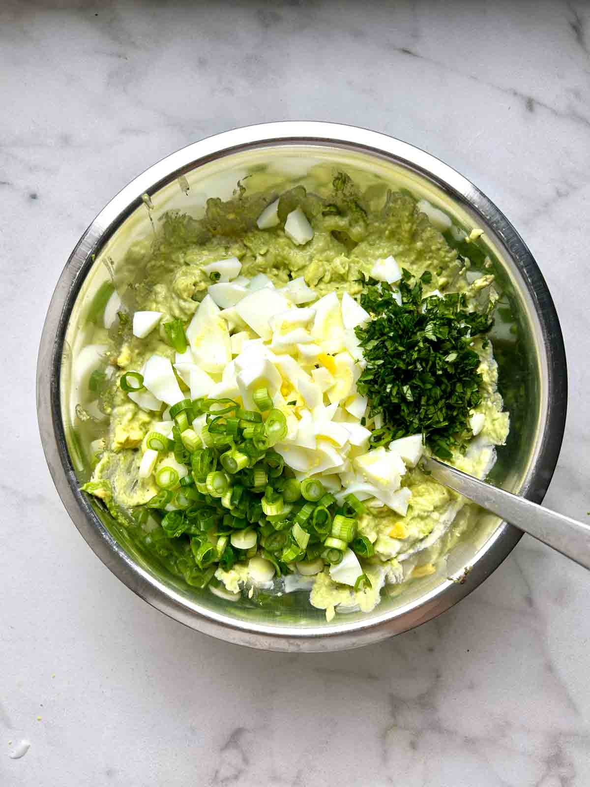green onions, parsley, and egg whites added on top of yolk mixture.