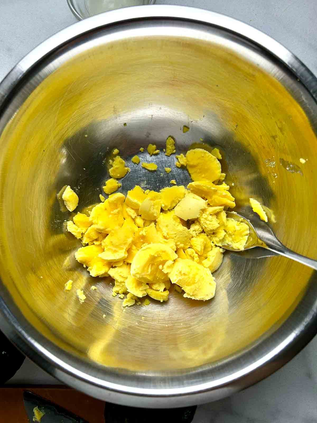 egg yolks added to bowl.