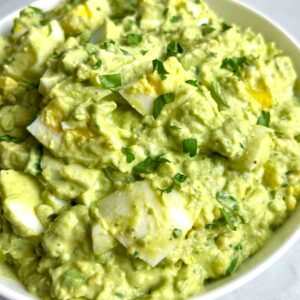 close up of avocado egg salad in bowl.