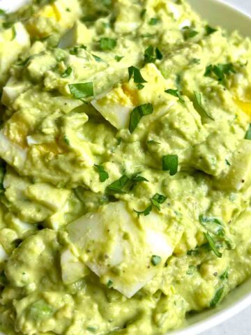 close up of avocado egg salad in bowl.