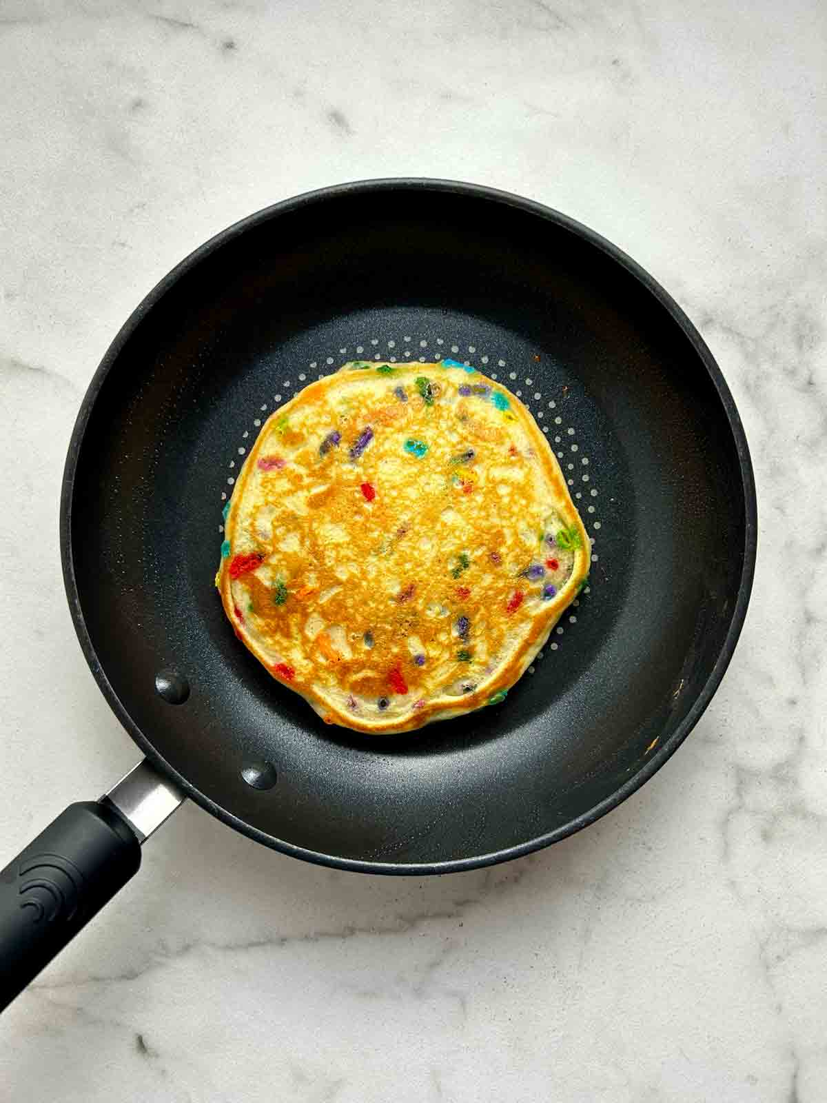 pancake flipped over to show golden brown bottom.