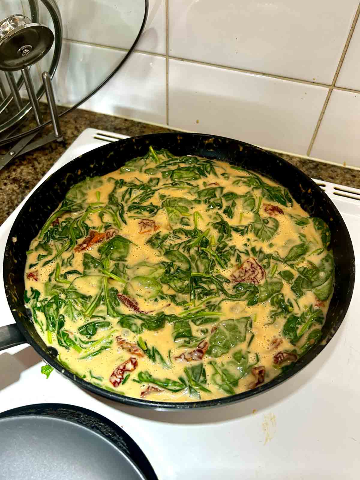 spinach wilted in sauce.