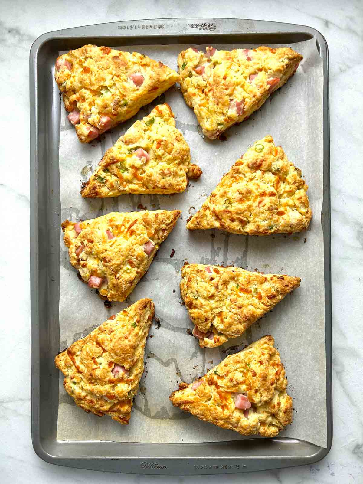 golden brown scones on baking sheet after baking.