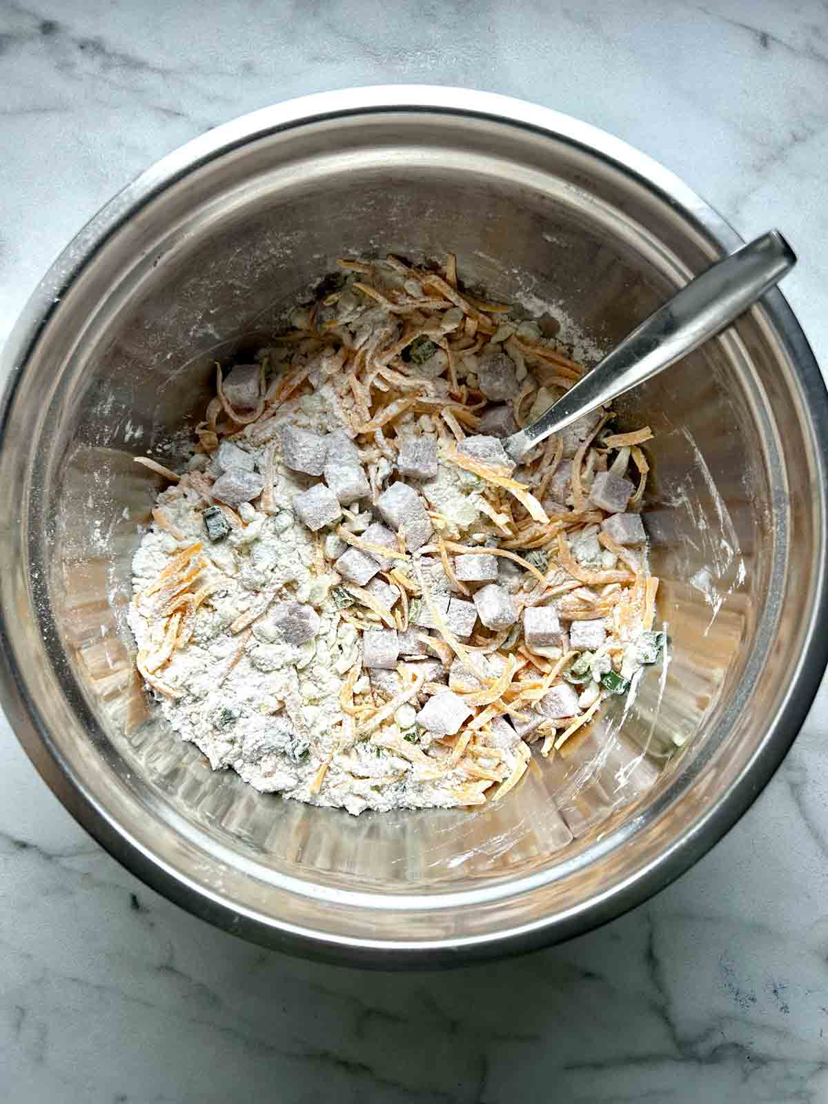 flour and butter mixture with ham, cheese, and green onions stirred into it.