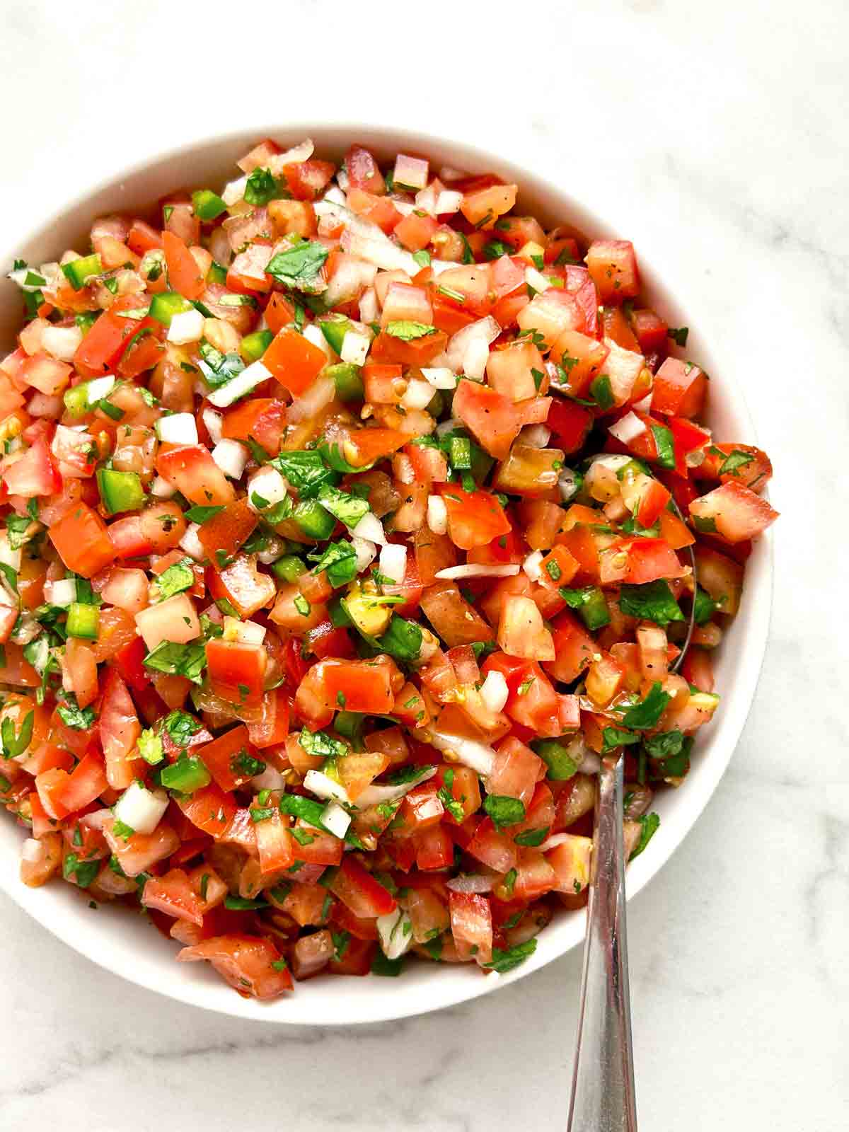 close up of pico de gallo in bowl.