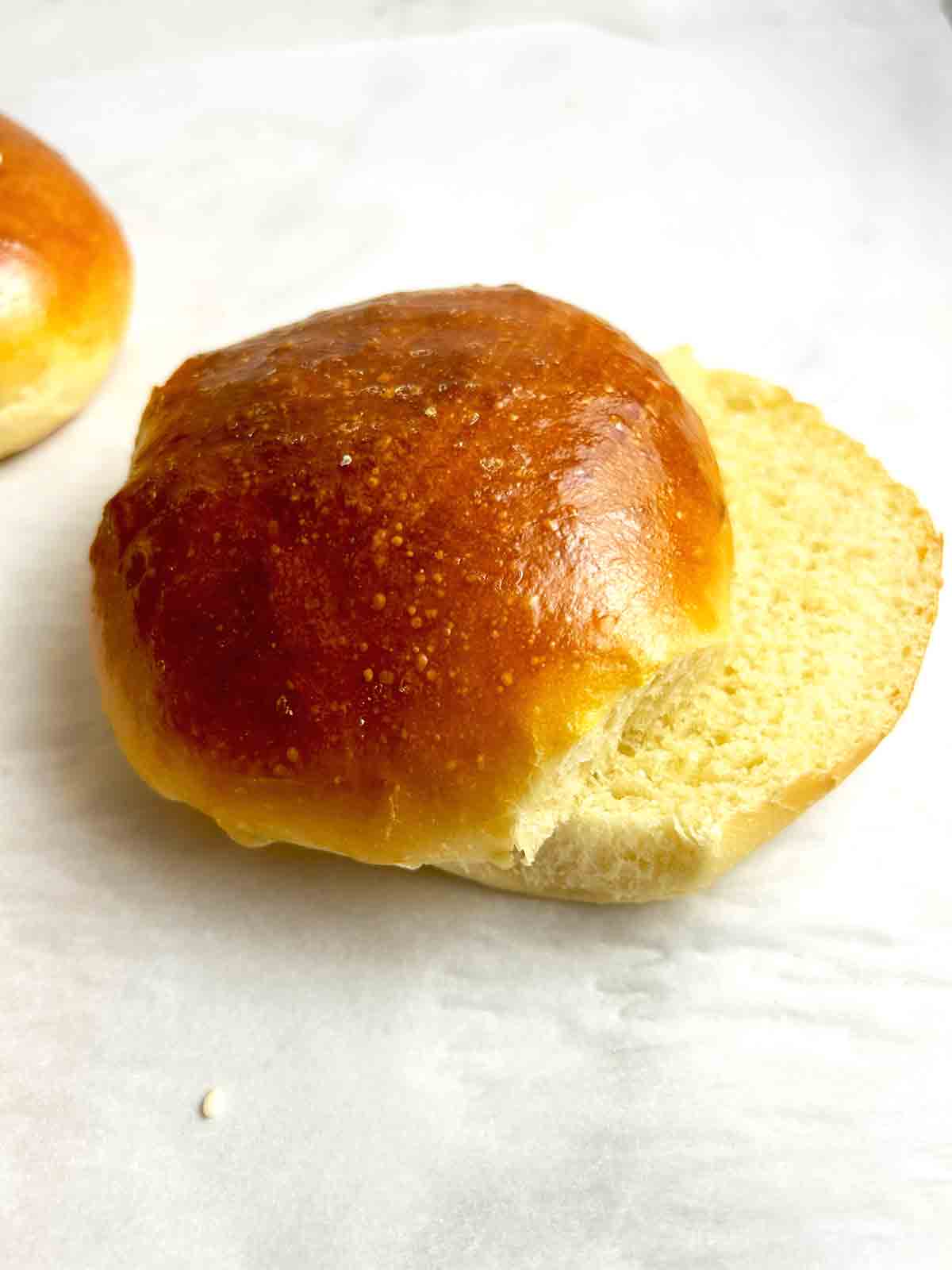close up of hamburger bun cut in half.