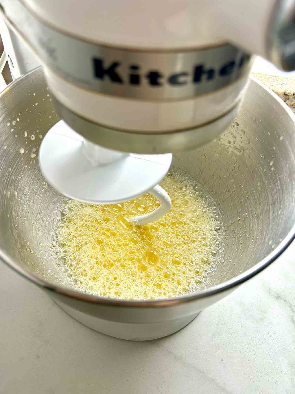 wet ingredients mixed in stand mixer bowl.