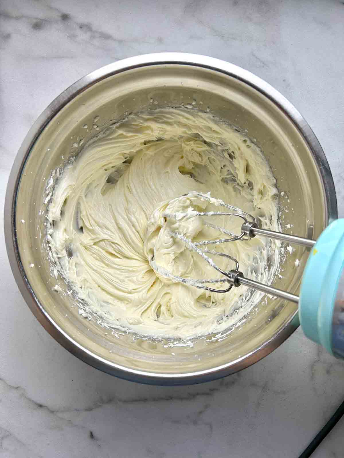 cream cheese and sugar blended until soft in bowl.