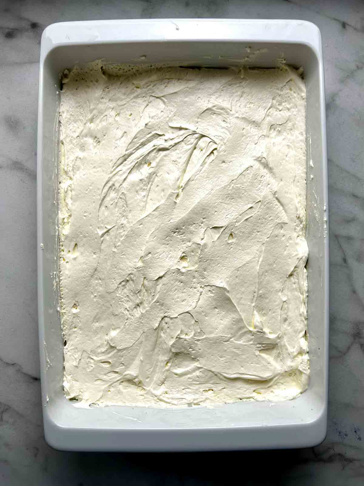 cream mixture spread on top of pretzel crust.