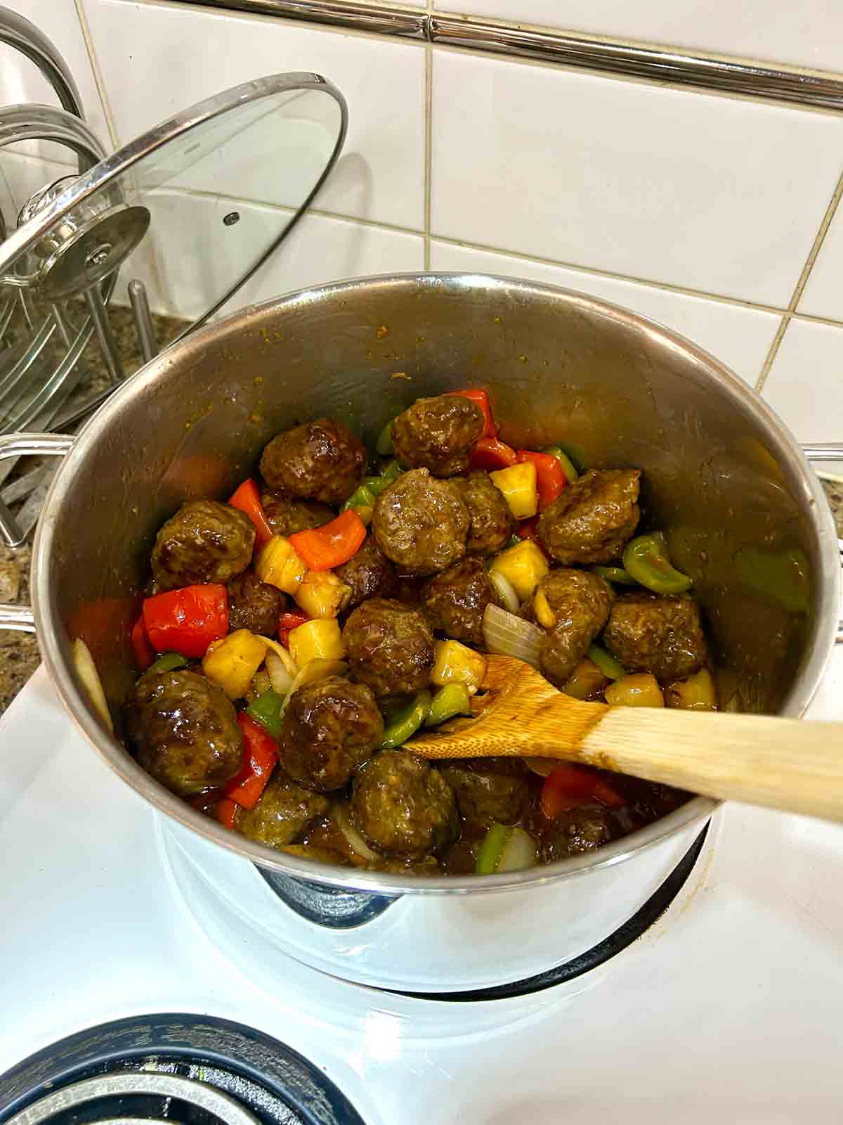 meatballs stirred into pot.