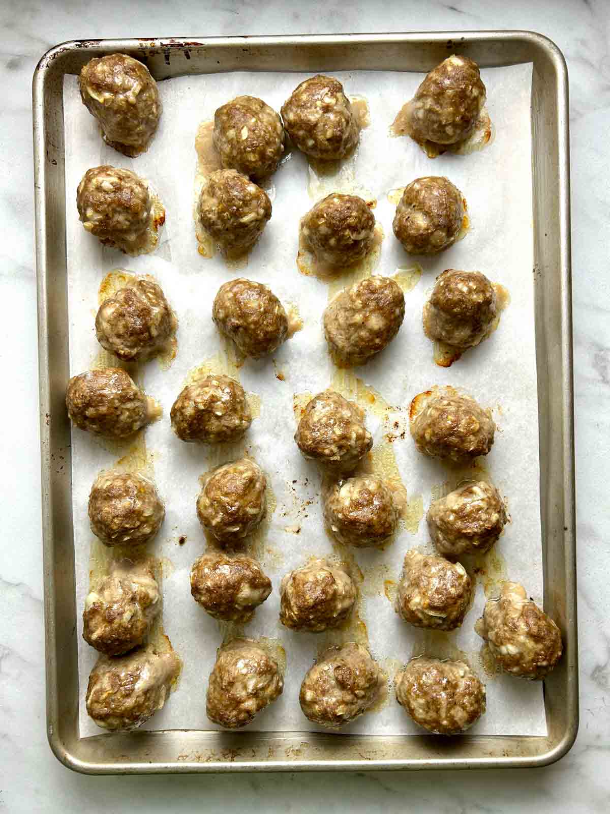 meatballs after being baked; brown.