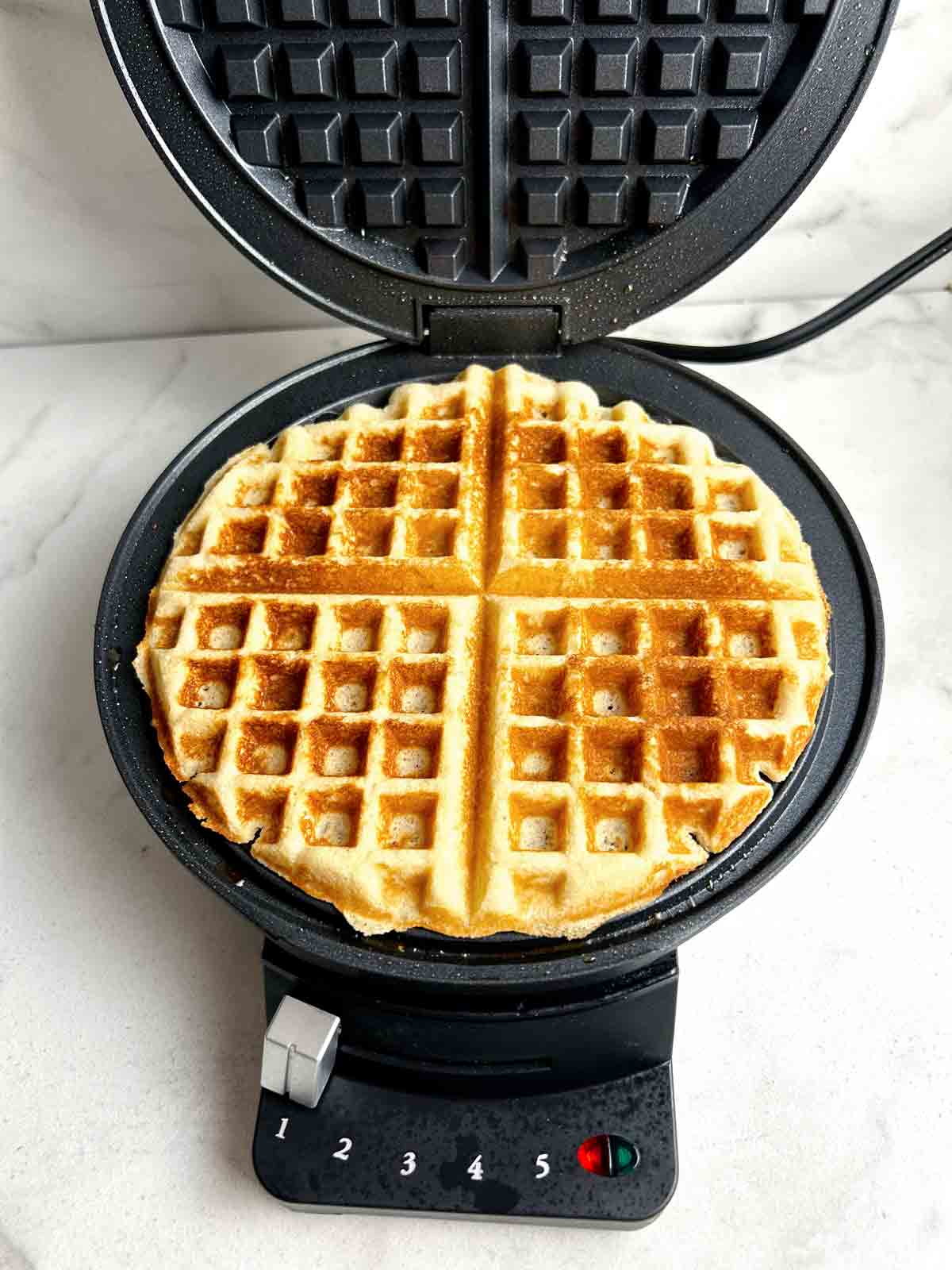 waffle golden brown after cooked in waffle maker.