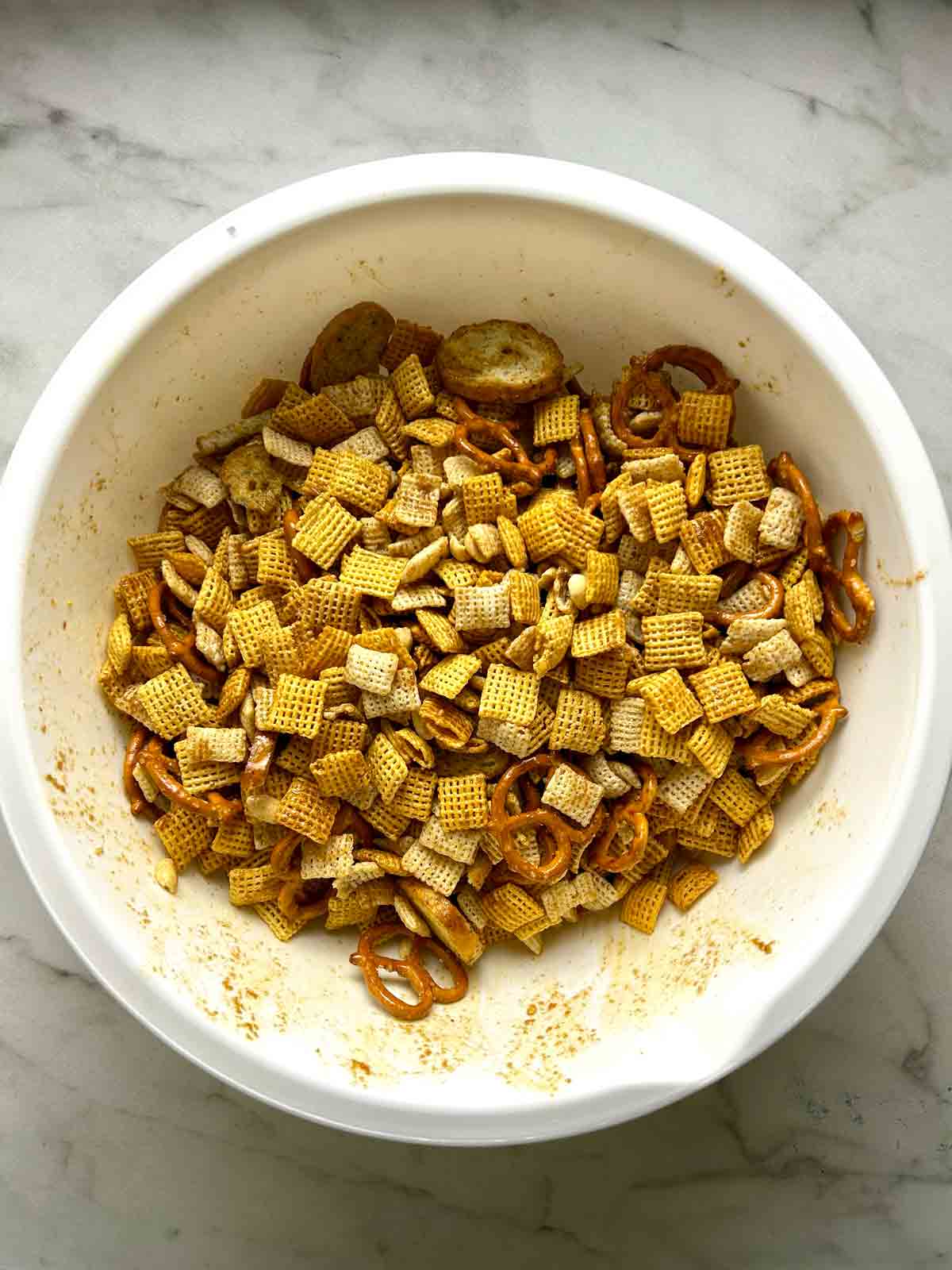 sauce tossed with cereals in bowl.