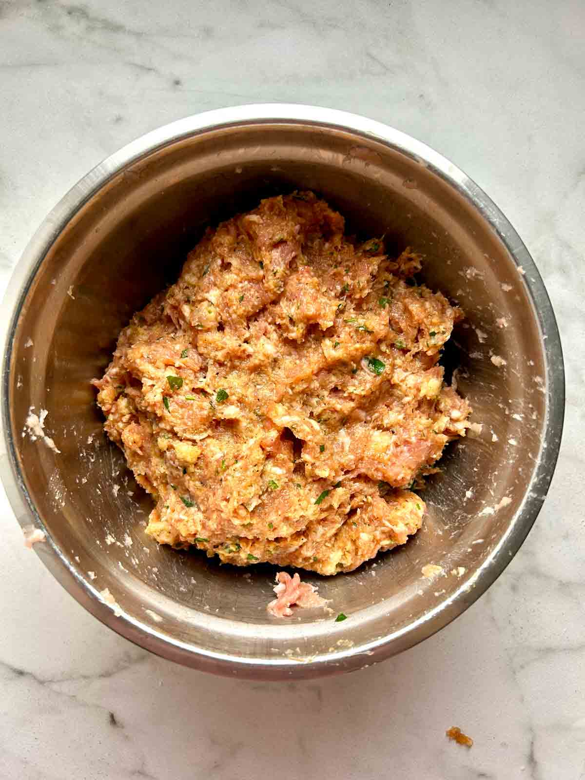 meat mixture combined in bowl.