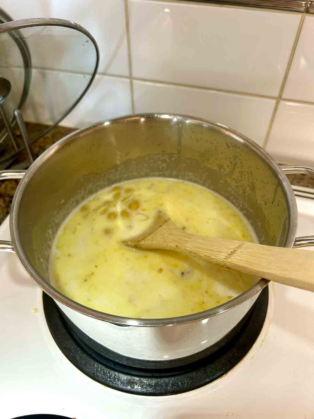 half and half, chicken broth, and pasta shells added to pot.