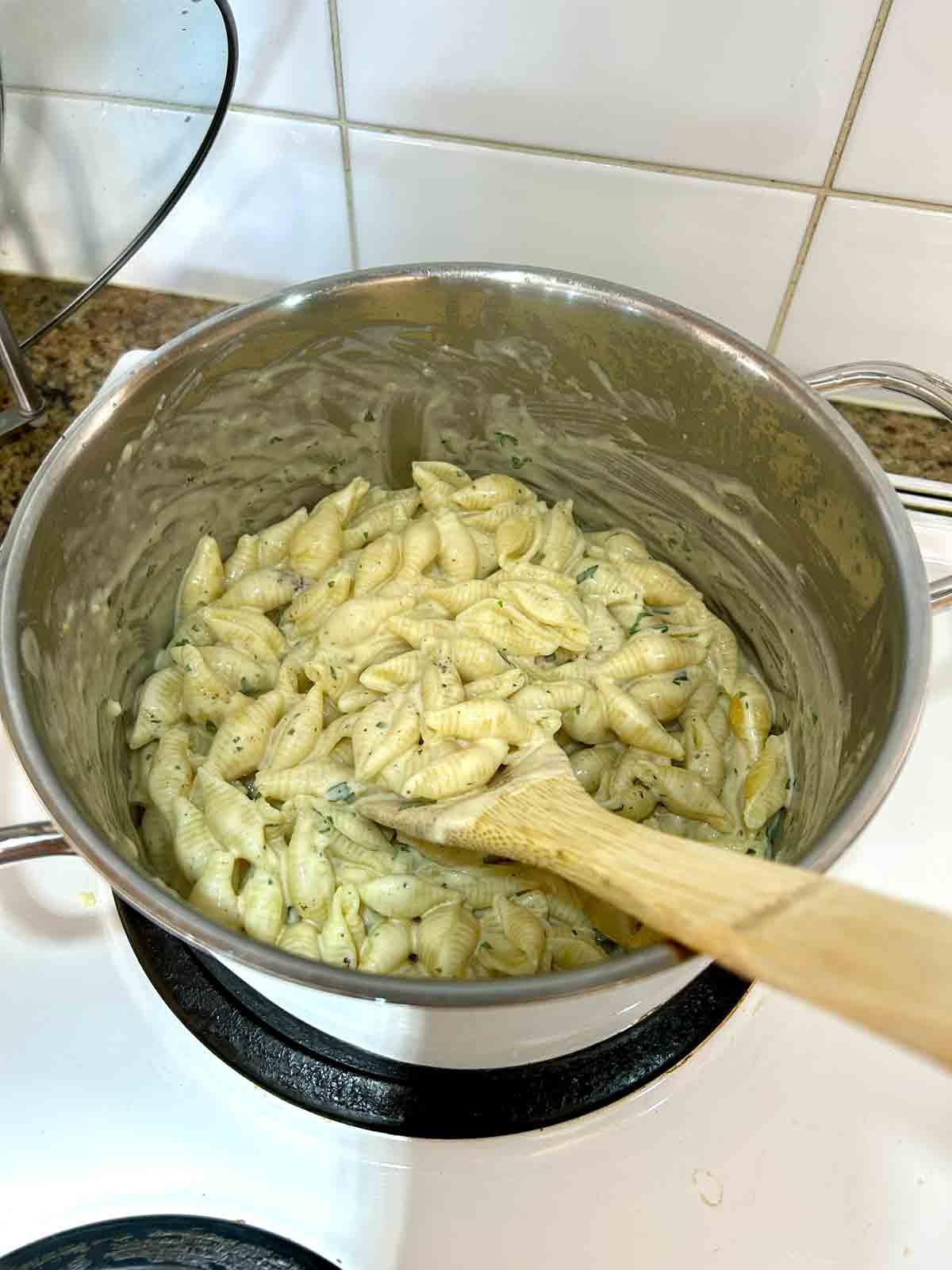 parmesan and parsley stirred into pasta and sauce.