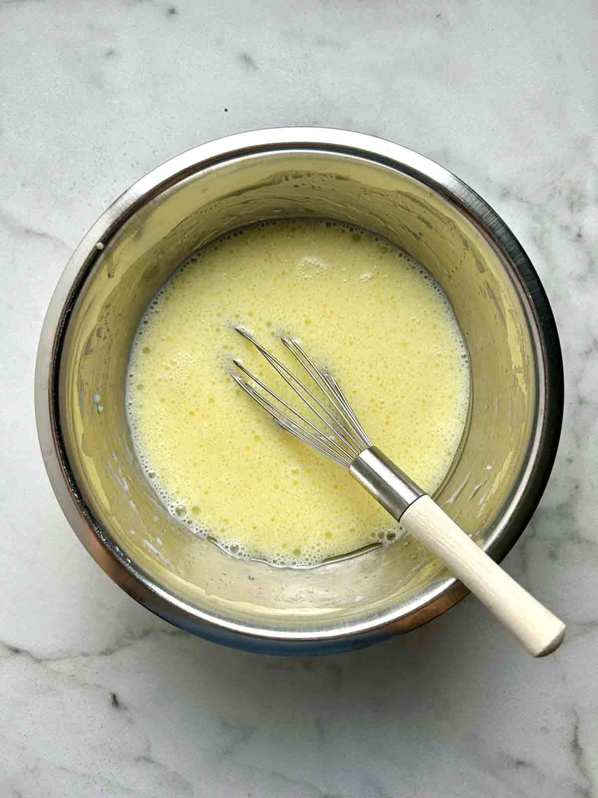 wet ingredients whisked together in bowl.