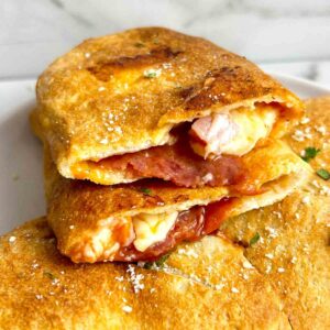 air fryer calzone cut in half to show inside.