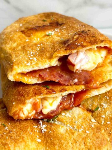 air fryer calzone cut in half to show inside.