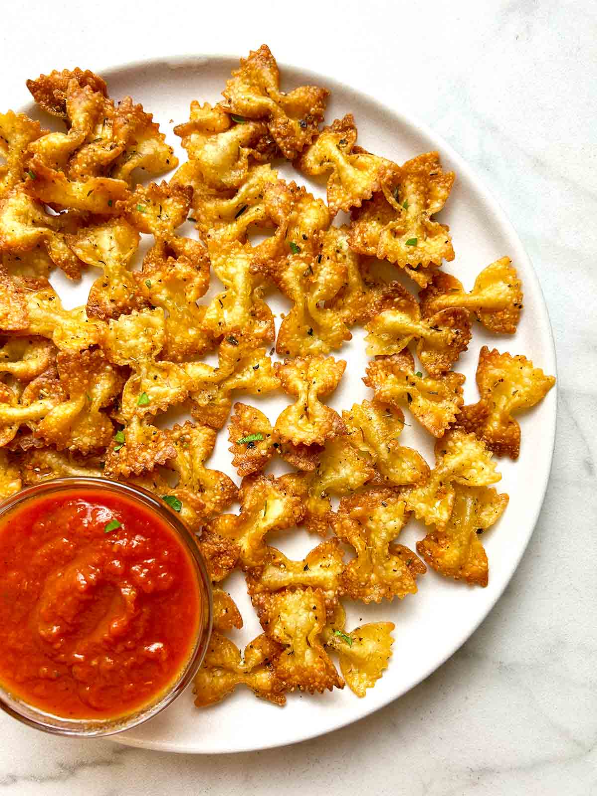 plate of air fried pasta chips.