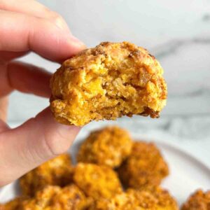 hand holding Bisquick sausage ball.