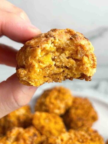 hand holding Bisquick sausage ball.