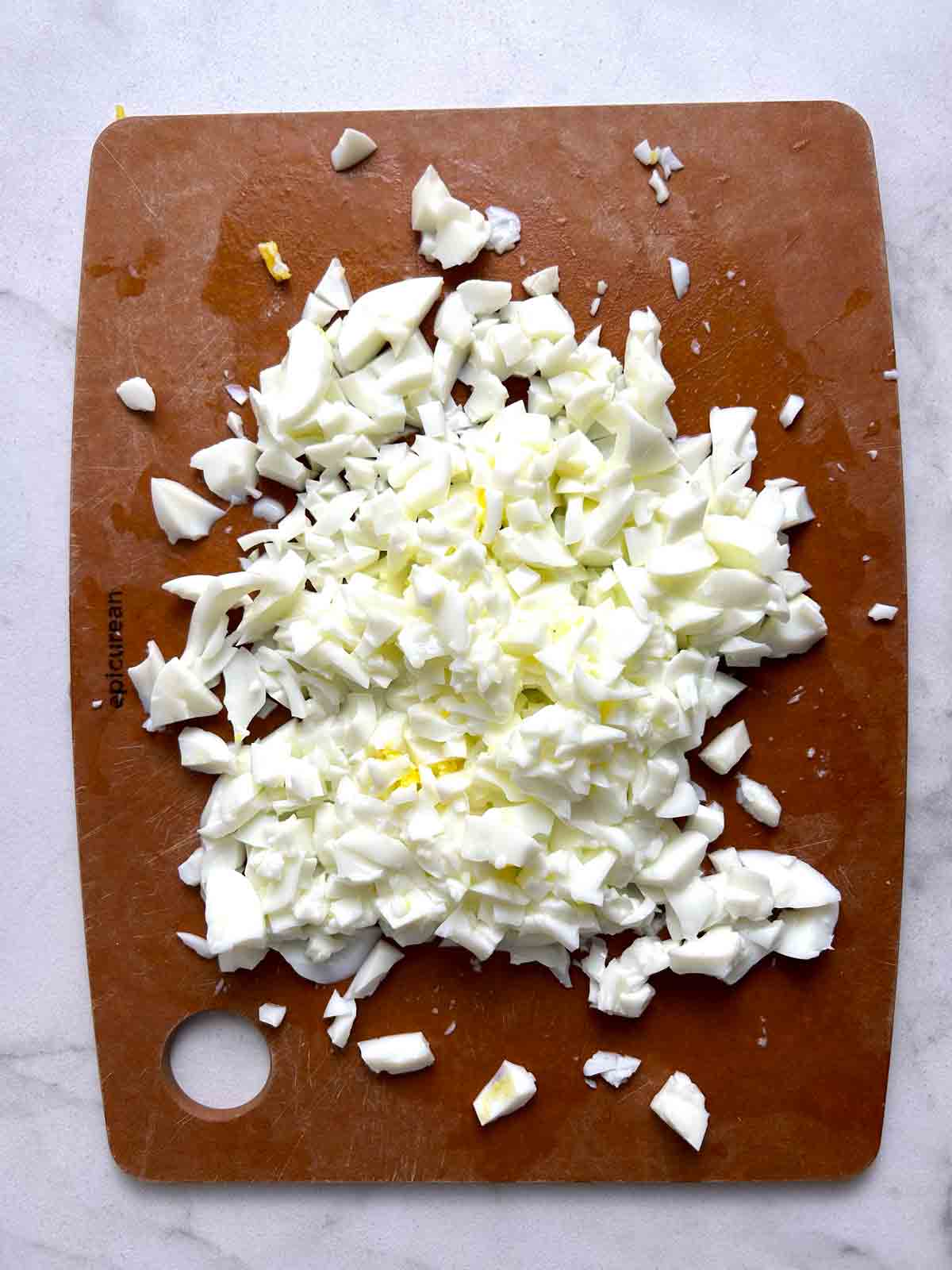 egg whites chopped on cutting board.