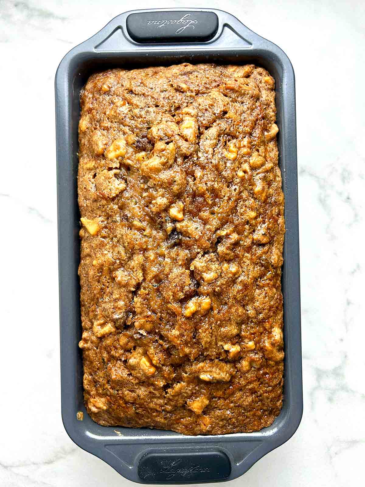 zucchini bread in pan after being baked.