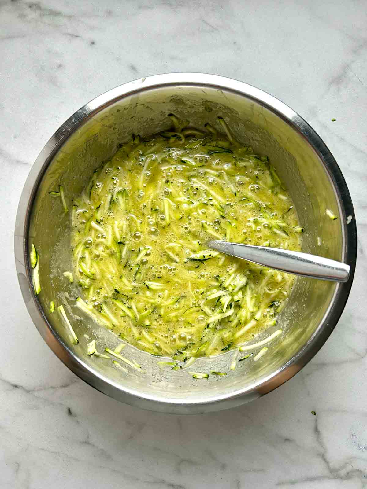 wet ingredients whisked together in bowl.