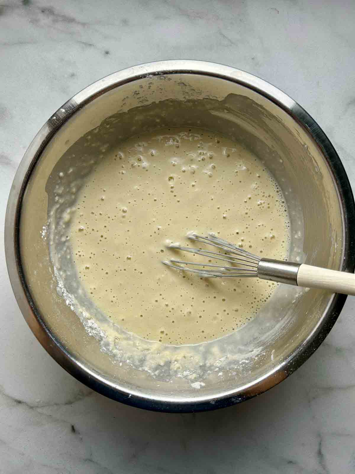 pancake batter whisked in bowl.