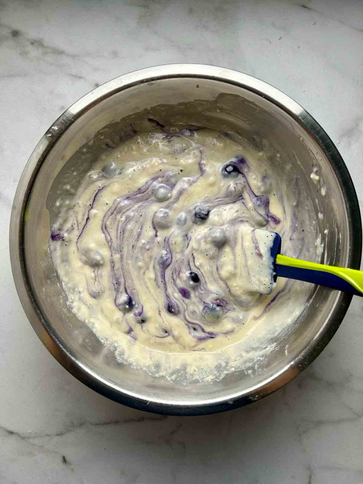 blueberries folded into batter.