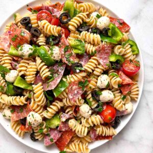 Italian pasta salad on white plate.