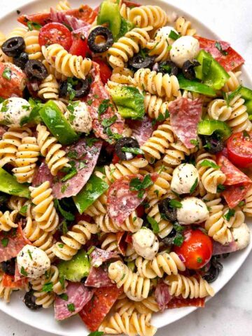 Italian pasta salad on white plate.